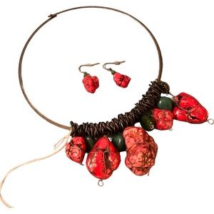 Pinkish Red stone, and metal necklace with matching earrings.